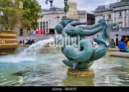 LONDON, UK - SEPTEMBER 8, 2018: sculpture on the marine theme in the fountain. Vacationers passersby Stock Photo