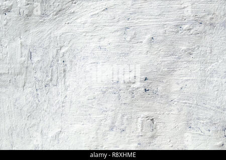 The uneven metal blue wall painted with white paint rough big dabs texture Stock Photo
