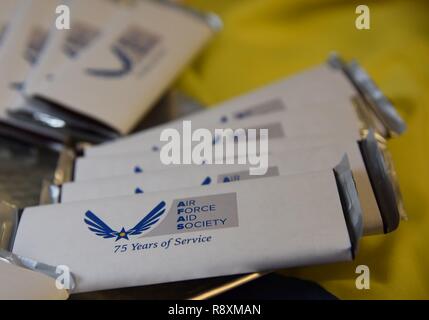 Mementos sit on display during the Air Force Aid Society 75th Anniversary Celebration at the Sablich Center March 10, 2017, on Keesler Air Force Base, Miss. Gen. Henry ‘Hap’ Arnold founded the relief organization in 1942, which is the official charity of the U.S. Air Force and exists to meet the unique needs of Total Force Airmen, their families and widows or widowers. Stock Photo