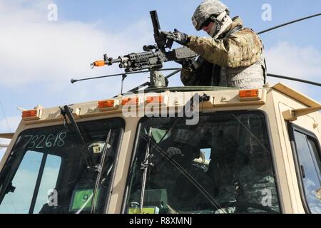 FORT MCCOY, Wis. - A U.S. Army Reserve Soldier with the 76th Operational Response Command, clears his weapon prior to beginning the blank-fire range during Operation Cold Steel at McCoy, Wis., March 14, 2017. Operation Cold Steel is the U.S. Army Reserve's crew-served weapons qualification and validation exercise to ensure that America's Army Reserve units and soldiers are trained and ready to deploy on short-notice and bring combat-ready and lethal firepower in support of the Army and our joint partners anywhere in the world. Stock Photo