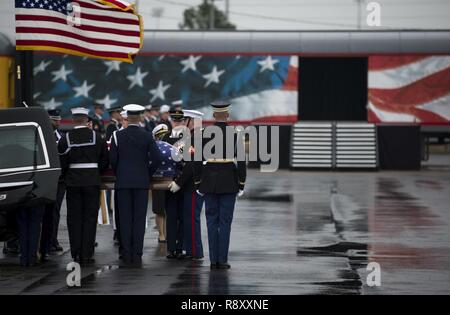 U.S. service members with the Joint Forces Honor Guard carry the casket of former U.S. President George H.W. Bush to a funeral car during a departure ceremony at Union Pacific Westfield Auto Facility, Spring, Texas, Dec. 6, 2018. The funeral car was pulled by the 4141 locomotive and carried George HW Bush's remains toward his final resting place. Nearly 4,000 military and civilian personnel from across all branches of the U.S. armed forces, including Reserve and National Guard components, provided ceremonial support during the state funeral of George H.W. Bush, the 41st President of the United Stock Photo