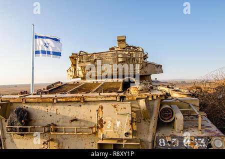 Israeli flag flying beside a decommissioned Israeli Centurion tank used during the Yom Kippur War at Tel Saki on the Golan Heights in Israel Stock Photo