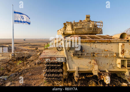 Israeli flag flying beside a decommissioned Israeli Centurion tank used during the Yom Kippur War at Tel Saki on the Golan Heights in Israel Stock Photo
