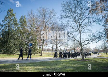 The U.S. Navy Ceremonial Guard helps conduct military funeral honors with funeral escort for U.S. Navy Seaman 1st Class William Bruesewitz in Section 60 of Arlington National Cemetery, Arlington, Virginia, Dec. 7, 2018. On Dec. 7, 1941, Bruesewitz was assigned to the battleship USS Oklahoma which was moored at Ford Island, Pearl Harbor when the ship was attacked by Japanese aircraft. After sustaining multiple torpedo hits, the USS Oklahoma quickly capsized and resulted in the deaths of 429 crewmen, including Bruesewitz.    From the Defense POW/MIA Accounting Agency (DPAA) new release: Followin Stock Photo