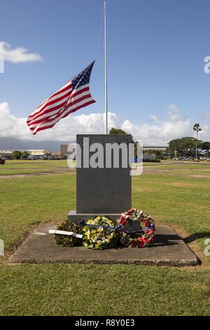 Wreaths are placed at the base of the Klipper Memorial Monument on Dec. 7, 2018 to honor those who gave their lives during the attack on Naval Air Station Kaneohe Bay 77 years ago today. The group annually visits the base to offer prayers and respects at the Pacific War Memorial, the Klipper Memorial and the Japanese Lt. Fusata Iida crash site marker. Stock Photo