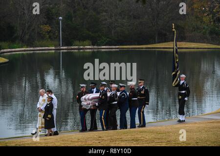 U.S. Service members carry the remains of George H. W. Bush to his burial site at the Bush Library in College Station, Texas, Dec. 6, 2018. Nearly 4,000 military and civilian personnel from across all branches of the U.S. armed forces, provided ceremonial support during the state funeral of George H. W. Bush, the 41st President of the United States. Stock Photo