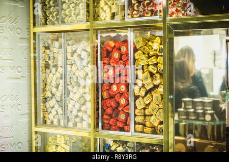 Milan, Italy - November 2, 2017: Showcase of the famous chocolate artisan Venchi in downtown Milan where chocolates are displayed on a fall day Stock Photo