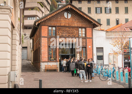 Como, Italy - November 4, 2017: People waiting in front of the como funicular entrance to climb to Brunate on a fall day Stock Photo