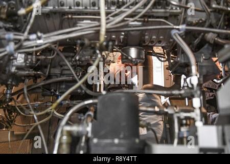 SOUTH CHINA SEA (March 3, 2017) Gas Turbine System Technician 2nd Class Andrew Mesenbrink, from Killen, Alabama, holds training on gas turbine generators during a tour of an engine room aboard Arleigh Burke-class guided-missile destroyer USS Wayne E. Meyer (DDG 108). Wayne E. Meyer is on a regularly scheduled Western Pacific deployment with the Carl Vinson Carrier Strike Group as part of the U.S. Pacific Fleet-led initiative to extend the command and control functions of U.S. 3rd Fleet into the Indo-Asia-Pacific region. U.S. Navy aircraft carrier strike groups have patrolled the Indo-Asia-Paci Stock Photo