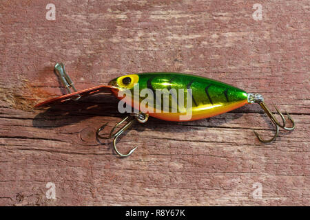 Artificial fishing lure with treble hooks on a white background Stock Photo  - Alamy
