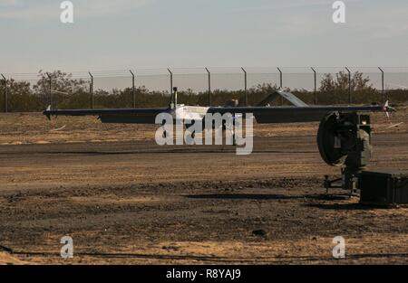 The last RQ-7B 'Shadow' lands March 9, 2017 at Cannon Air Defense Complex at Marine Corps Air Station Yuma, Arizona.  VMU-1 will be replacing the RQ-7B 'Shadow' with the RQ-21 'Blackjack,' a more capable drone that uses less launch space than its predecessor. Stock Photo