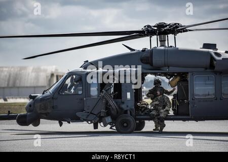 An HH-60 Pavehawk crew from the 33rd Rescue Squadron awaits take off from the flightline March 7, 2017, at Kadena Air Base, Japan. Members of the 33rd and 31st Rescue Squadrons train and work together to provide support for combat rescue and disaster relief. Stock Photo