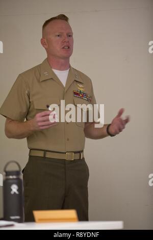 U.S. Marine Capt. Scott L. Campbell, maintenance officer with Marine Aviation Weapons and Tactics Squadron One (MAWTS-1) welcomes students attending the first ever Advanced Aircraft Maintenance Officer Course (AAMOC) at Marine Corps Air Station Yuma, Ariz., on Mar. 13, 2017. AAMOC will empower Aircraft Maintenance Officers with leadership tools, greater technical knowledge, and standardized practices through rigorous academics and hands on training in order to decrease ground related mishaps and increase sortie generation.