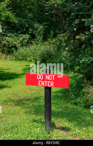 Do not enter sign along a forest path Stock Photo - Alamy