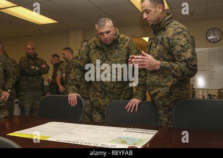 U.S. Marine Corps Lt. Col. John S. Sattely, Commanding Officer, 2nd Transportation Support Battalion, Combat Logistics Regiment 2, 2nd Marine Logistics Group (MLG), explains future operations to Lt. Gen. John E. Wissler, Commander, U.S. Marine Corps Forces Command, Commanding General, Fleet Marine Forces, Atlantic, during his visit to Camp Lejeune, N.C., March 15, 2017. Wissler visited 2nd MLG to conduct a commanders workshop, engage senior leaders on designated topics, and observe training activities at various 2D MLG units. Stock Photo