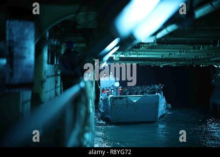 A landing craft utility carrying Spanish Marines enters the well deck ...