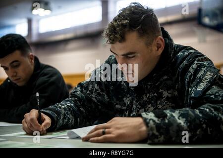 YOKOSUKA, Japan (March 16, 2017)  Aviation Ordnanceman Airman Joshua Emmons, assigned to the aircraft carrier USS Ronald Reagan (CVN 76), takes the Navy-wide E-4 advancement exam at James D. Kelly Fleet Recreation Center. Ronald Reagan is the flagship of Carrier Strike Group 5, providing a combat-ready force that protects and defends the collective maritime interests of its allies and partners in the Indo-Asia-Pacific region. Stock Photo