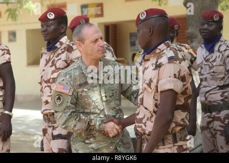 Brig. Gen. Donald Bolduc, commander, Special Operations Command Africa, greets Chadian personnel participating in the Flintlock 2017 closing ceremony March 16, 2017 in N'Djamena, Chad. Flintlock is an annual special operations exercise involving more than 20 nation forces that strengthens security institutions, promotes multinational sharing of information, and develops interoperability among partner nation in North and West Africa. Stock Photo