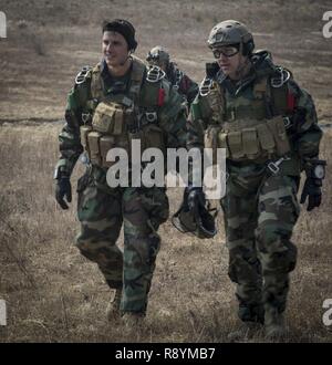 Capt. Ben Skarzynski (left) and Staff Sgt. Xavier Ovando (right) walk to a U.S. Army CH-47 Chinook at Josari drop zone, Republic of Korea, March 16, 2017, as part of Korea Marine Exercise Program 17-6. KMEP highlights the two countries’ combined commitment to the defense of the ROK and our shared commitment to peace and security in the region. Skarzynski, a Bethesda, Maryland native, is the platoon commander with 3d Reconnaissance Battalion, 3rd Marine Division, III Marine Expeditionary Force. Ovando, a Los Angeles, California native, is the platoon sergeant with 3d Reconnaissance Battalion, 3 Stock Photo