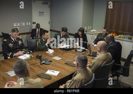 U.S. Marines, Japanese Self-Defense Force and other guests attend an international partnerships meeting at the Naval Support Facility Arlington, Arlington, Va., March 9, 2017. The meeting was held to share ideas regarding inspector generals of both the Marine Corps and the Japanese Self-Defense Force. Stock Photo