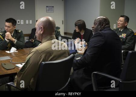 U.S. Marines, Japanese Self-Defense Force and other guests attend an international partnerships meeting at the Naval Support Facility Arlington, Arlington, Va., March 9, 2017. The meeting was held to share ideas regarding inspector generals of both the Marine Corps and the Japanese Self-Defense Force. Stock Photo