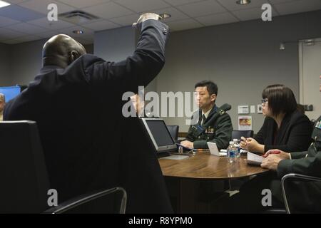 SES Carl E. Shelton, deputy inspector general of the Marine Corps, gives remarks during an international partnerships meeting at the Naval Support Facility Arlington, Arlington, Va., March 9, 2017. The meeting was held to share ideas regarding inspector generals of both the Marine Corps and the Japanese Self-Defense Force. Stock Photo