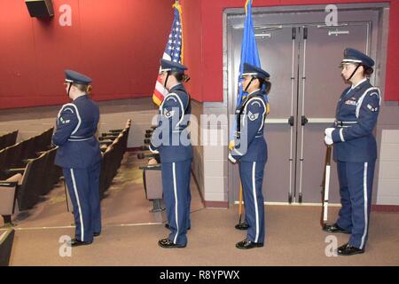 --  An all-female Honor Guard team prepares to present the colors during the Robins Diversity Council’s  “Herstory” Women’s History Month Panel at the Base Theater March 17, 2017. The purpose the event was to highlight some modern day, local “Sheroes” that are at the top of their respective career ladders. Honor Guard members included: Staff Sgt. Katherine Dean, 16th Airbone Command & Control Squadron; Airman First Class Mckenzie Hinshaw, 461st Maintenance Group; Airman First Class Heather Schmidt, 51st Combat Communications Squadron; and Staff Sgt. Annzen Salvador, 78th Force Support Squadron Stock Photo
