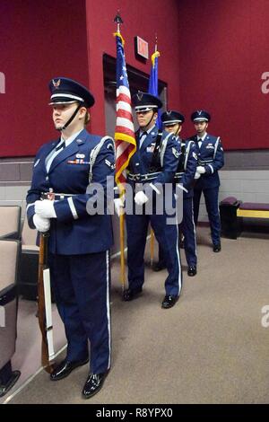 --  An all-female Honor Guard team prepares to present the colors during the Robins Diversity Council’s  “Herstory” Women’s History Month Panel at the Base Theater March 17, 2017. The purpose the event was to highlight some modern day, local “Sheroes” that are at the top of their respective career ladders. Honor Guard members included: Staff Sgt. Katherine Dean, 16th Airbone Command & Control Squadron; Airman First Class Mckenzie Hinshaw, 461st Maintenance Group; Airman First Class Heather Schmidt, 51st Combat Communications Squadron; and Staff Sgt. Annzen Salvador, 78th Force Support Squadron Stock Photo