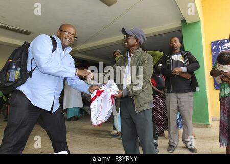 Larry Robinson, exercise security planner with U.S. Army Africa, makes a donation of more than 400 articles of clothing and shoes to survivors of the Mar. 11 landslide that killed 113, at a donation collection camp in Addis Ababa, Ethiopia, Mar. 17,2017. Robinson is in Addis Ababa for the USARAF-led exercise Justified Accord 17, which is an annual joint exercise that brings together U.S. Army personnel, African partners, allies and international organizations to promote interoperability between participating nations for peace keeping operations in the East Africa region. Stock Photo
