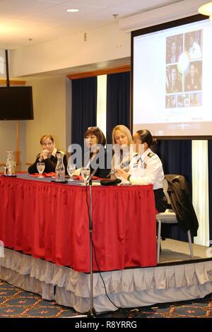 A guest speaker panel comprising (left to right) Capt. Kimberly Elenberg with the U.S. Public Health Service at the Pentagon, Pastor Ethell Tillis with the Tomah (Wis.) Pentecostal Assembly, Lori Freit-Hammes with the Mayo Clinic Health System-Franciscan Healthcare in La Crosse, and 1st Sgt Leah Mariano with the Staff Sgt. Todd R. Cornell Noncommissioned Officer Academy participates in the installation observance of Women’s History Month on March 16, 2017, at McCoy’s Community Center at Fort McCoy, Wis. Dozens of people attended the event to learn more about each panel member’s history and hea Stock Photo