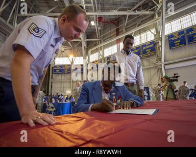 Davontre Wigfall (pictured right), a college student from Mount Pleasant, S.C., was sworn into the U.S. Air Force Reserve by an original Tuskegee Airman, (Ret.) Lt. Col. Enoch Woodhouse during the Tuskegee Airmen Career Day Feb. 23, 2017, at Joint Base Charleston, S.C. Upon graduation from basic training and tech. school, Wigfall will return to the 315th Airlift Wing as a member of the 38th Aerial Port Squadron. Stock Photo