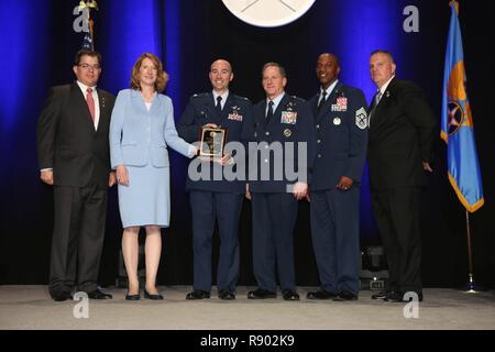 Lt. Col. Scott, former 432nd Operations Support Squadron commander, accepts the inaugural Jimmy Doolittle Educational Fellow for Outstanding Support to Armed UAVs March 2, 2017, at the Martin H. Harris Chapter of the Air Force Association Air Force Gala banquet in Orlando, Florida. Acting Secretary of the Air Force, Lisa Disbrow, presented the award alongside, from left, Air Force Gala Chairman Michael Liquori, Chief of Staff of the Air Force Gen. David Goldfein, Chief Master Sgt. of the Air Force Kaleth Wright and Martin H. Harris Chapter President Gary Lehmann.