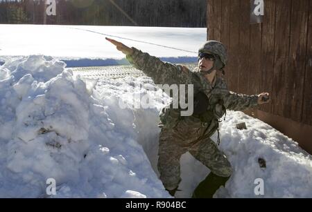 U.S. Army Pfc. Philip Plevel, gunner, Bravo Battery, 1st Battalion, 101st Field Artillery Regiment, Vermont National Guard, is tested on his knowledge of how to use a grenade during the Vermont Best Warrior Competition at Camp Ethan Allen Training Site, Jericho, Vt., March 18, 2017.  Vermont soldiers compete in a variety of Soldier tasks in order to move onto the regional competition in April. Stock Photo