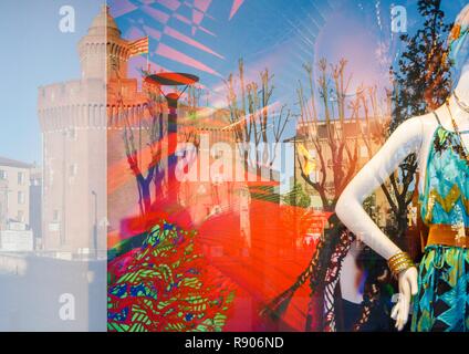 France, Pyrenees Orientales, Perpignan, city center, reflection of the Castillet in a window at sunset Stock Photo