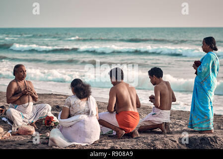 Varkala, Kerala, India - Nov 30, 2017: Diwali festival. Diwali celebration on Varkala beach. Peoples come to  brahmanas for perform puja and make offe Stock Photo