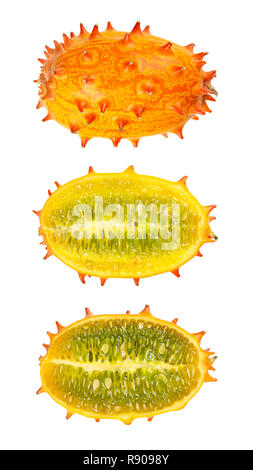 Kiwano, horned melon, whole and half fruit isolated over white. African horned cucumber, jelly melon, hedged gourd or melano. Stock Photo