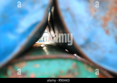 old red oil barrell in the dock background crude oil price in hong kong china Stock Photo