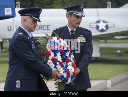 U.S. Air Force Col. R. Scott Jobe, left, the 35th Fighter Wing commander, and Japan Air Self-Defense Force Maj. Gen. Koji Imaki, right, the 3rd Air Wing commander, carry a Memorial Day wreath at Misawa Air Base, Japan, May 26, 2017. Service members from all branches attended Misawa's 2017 Memorial Day service to honor those who paid the ultimate prices for the freedom they have today. Stock Photo