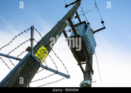 Dynamic Images of power distribution pylons against a blue sky Stock Photo