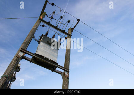 Dynamic Images of power distribution pylons against a blue sky Stock Photo