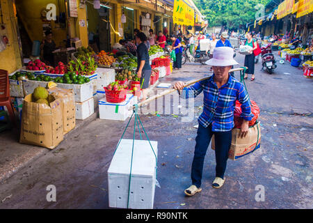 Vendor in a market in Hanoi Vietnam Stock Photo