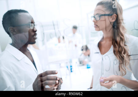 multinational scientists work in a modern laboratory Stock Photo