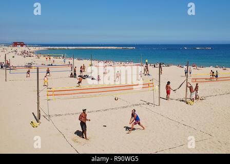 People play volley ball on the beach at Barcelona in Catalonia, Spain on April 17, 2018. Stock Photo