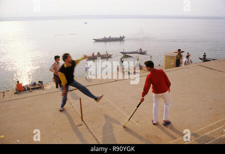 Boys playing cricket on Ganga Ghat, Banaras, Benaras, Varanasi, Uttar Pradesh, India, Asia Stock Photo