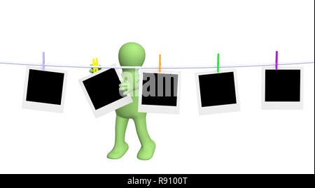 Puppet with five empty blanks of photos Stock Photo
