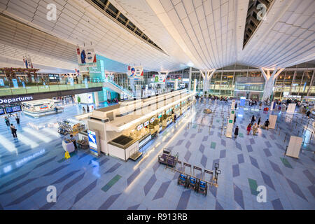 TOKYO, JAPAN - September 1, 2015: Passengers enter Haneda Airport. Haneda is one of the two primary airports that serve the Greater Tokyo Area. Stock Photo