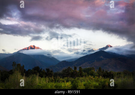 Mountains at sunset cloudy sky in Almaty, Kazakhstan, Central Asia Stock Photo