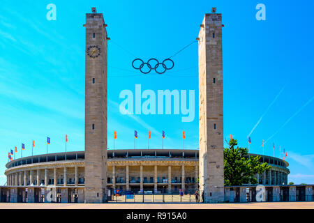 Berlin, Berlin state / Germany - 2018/07/31: Exterior of the historic Olympiastadion sports stadium originally constructed for the Summer Olympic in 1 Stock Photo