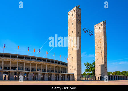 Berlin, Berlin state / Germany - 2018/07/31: Exterior of the historic Olympiastadion sports stadium originally constructed for the Summer Olympic in 1 Stock Photo