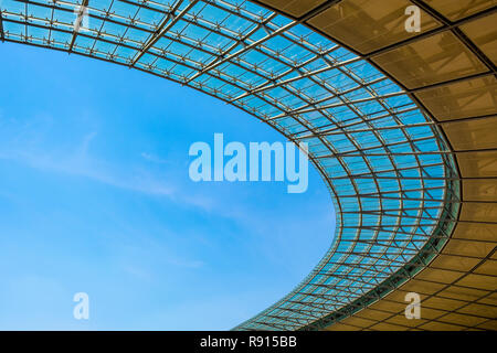 Berlin, Berlin state / Germany - 2018/07/31: Transparent roof covering inner space of the historic Olympiastadion sports stadium originally constructe Stock Photo